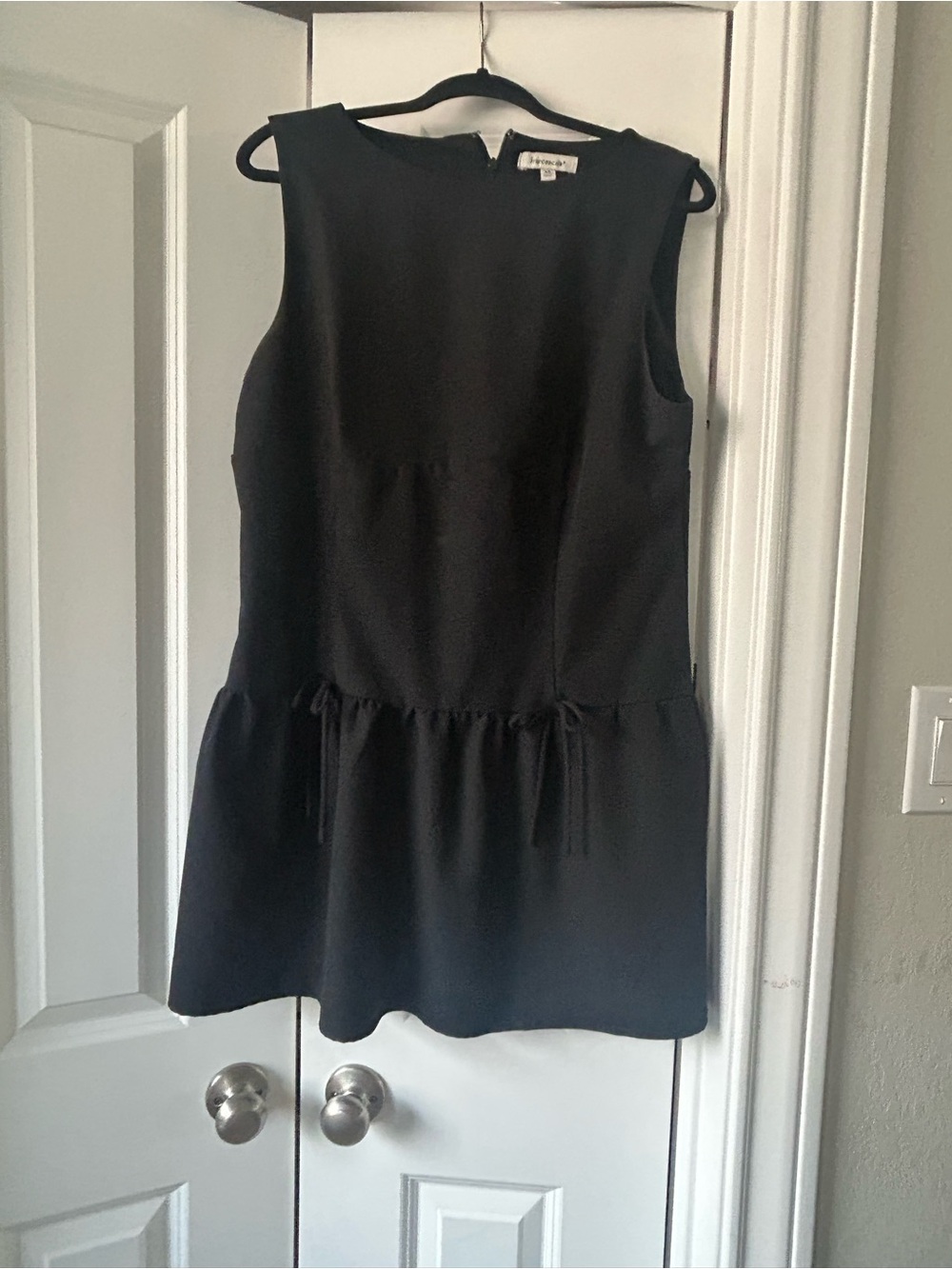 Francesca's Collections Black Sleeveless Peplum Tunic